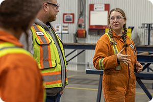 industrial shop workers conversing