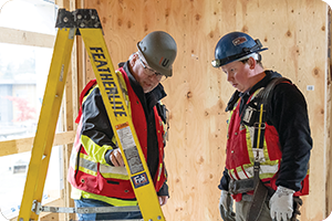 two workers discussing safety