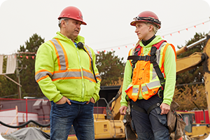 two workers discussing safety